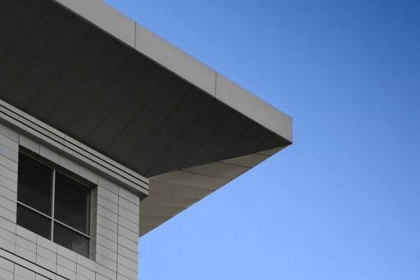 Abstract architectural photo of detail of building and blue sky