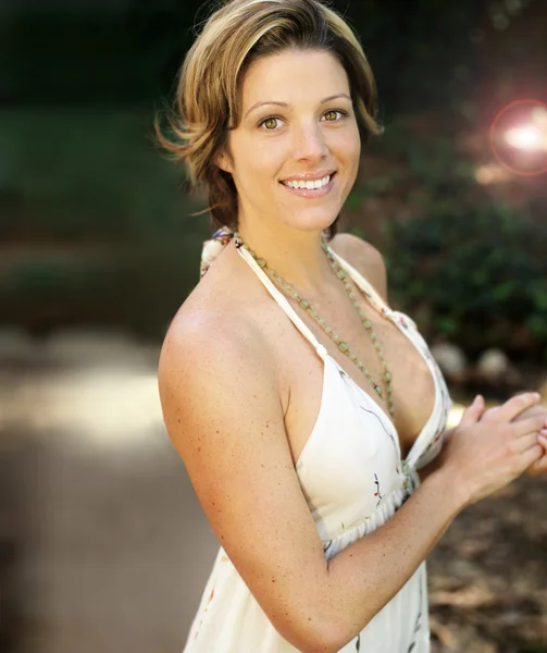 Woman smiling outside — Stock Photo, Image