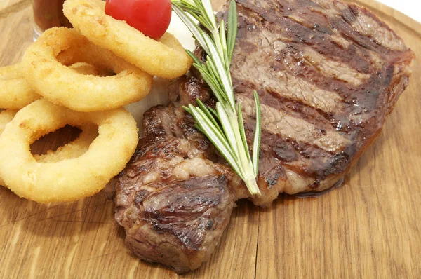 Juicy beef steak cooking — Stock Photo, Image