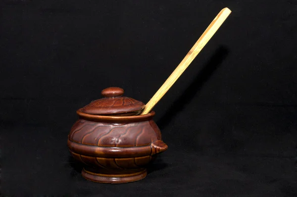 Pot and wooden spoon — Stockfoto