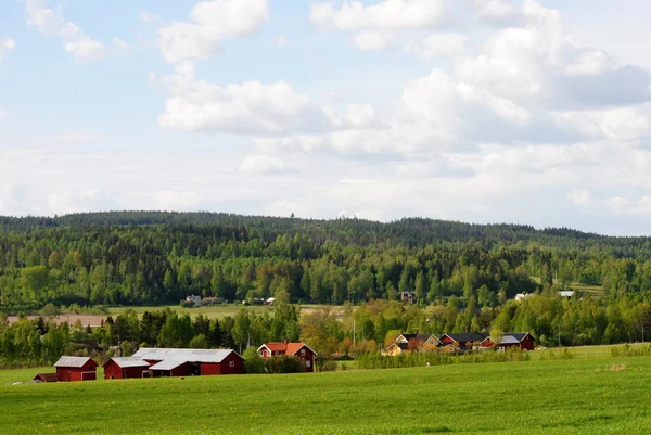 Landschaft mit Bauernhof Stockbild