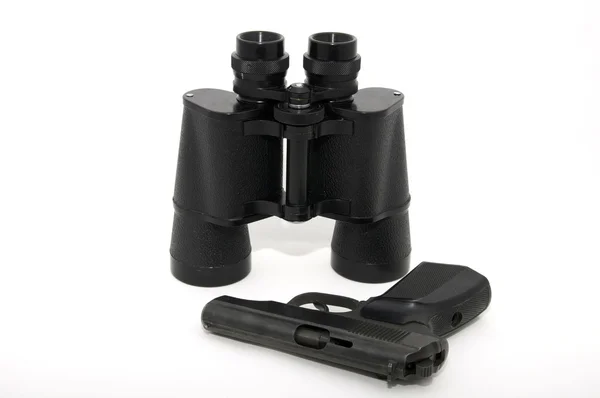 Binoculars and gun — Stock Photo, Image