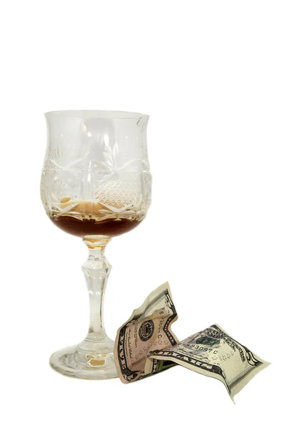 Пустой стакан грога и чаевых долларов — стоковое фото
