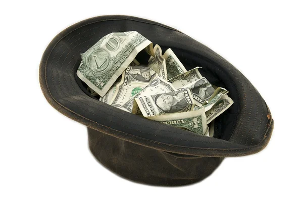Small notes of dollars in the hat — Stock Photo, Image