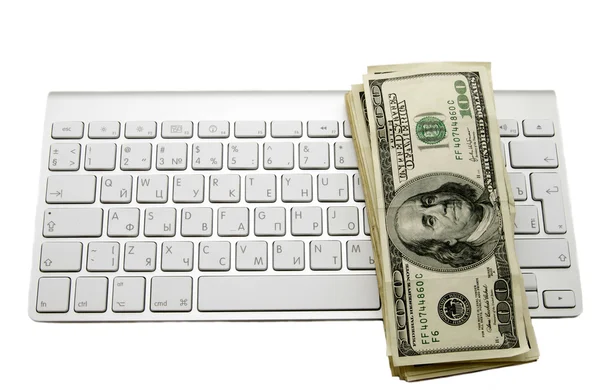 Green dollars on the keyboard — Zdjęcie stockowe