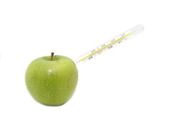 Manzana verde y un termómetro médico — Foto de Stock