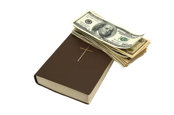 Библия и доллары — стоковое фото