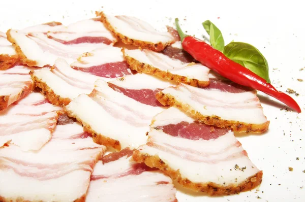 Plátky slaniny a pepř — Stock fotografie