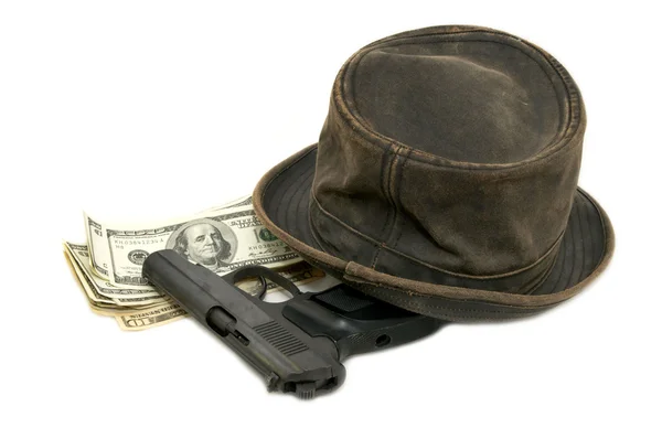 stock image Dollars and a gun and a hat