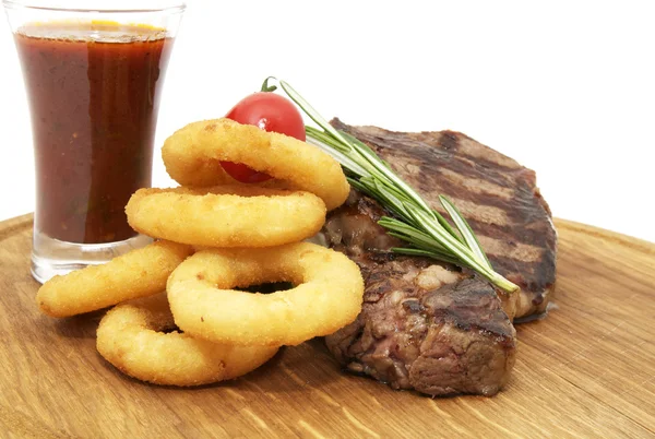 Steak and onion rings — Stock Photo, Image
