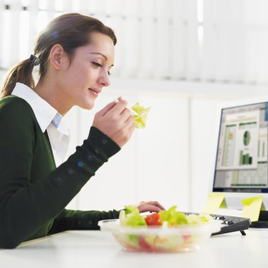 Woman eating salad clipart