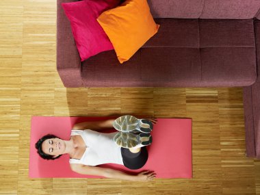 Woman doing abs exercise at home