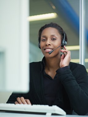 Woman working in call center clipart