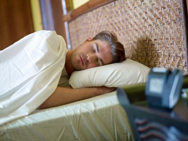 Young adult man sleeping clipart