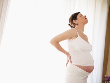 Pregnant woman having backache clipart