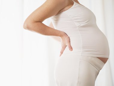 Pregnant woman having backache clipart