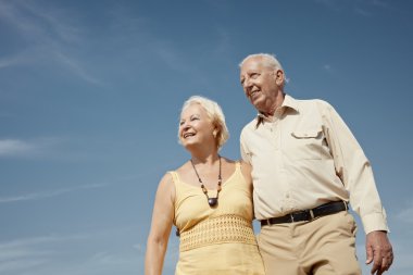 Old man and woman contemplating the sky clipart