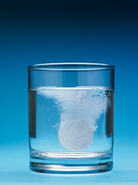 Painkiller dissolving in water clipart