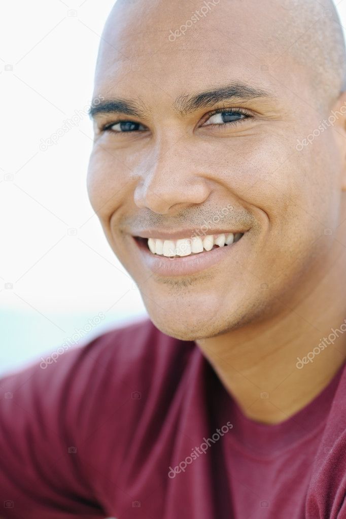 Young latino man smiling at camera