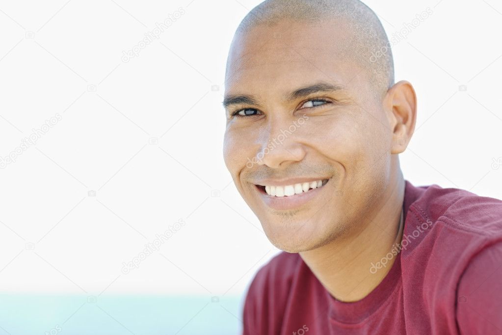 Young latino man smiling at camera