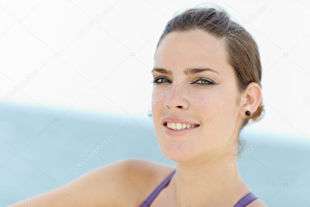 Young beautiful woman smiling at camera