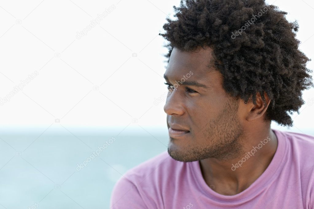 Young african man on the beach