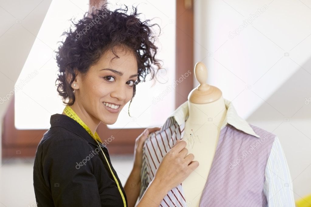 Woman working in fashion design studio