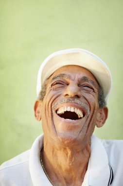 Aged latino man smiling for joy clipart