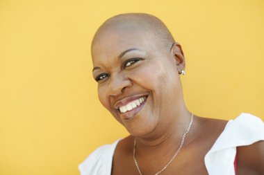 Mature african woman smiling at camera clipart