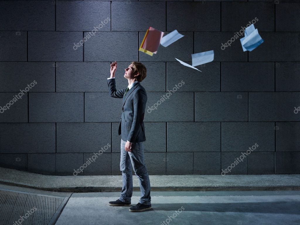 Businessman throwing away files and documents — Stock Photo © diego_cervo 9750075