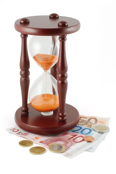 Reloj de arena y dinero — Foto de Stock