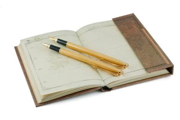 Notebook és a toll arany — Stock Fotó