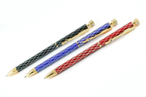 Три цветных шариковых ручки — стоковое фото