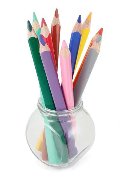 Färgade pennor i en glasburk — Stockfoto