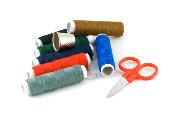 stock image Colorful spools, scissors and a thimble