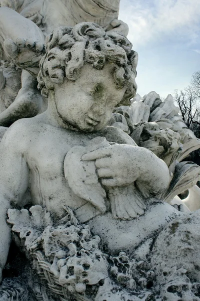 Detail of a cherub sculpture of Bacchus — Stock Photo, Image
