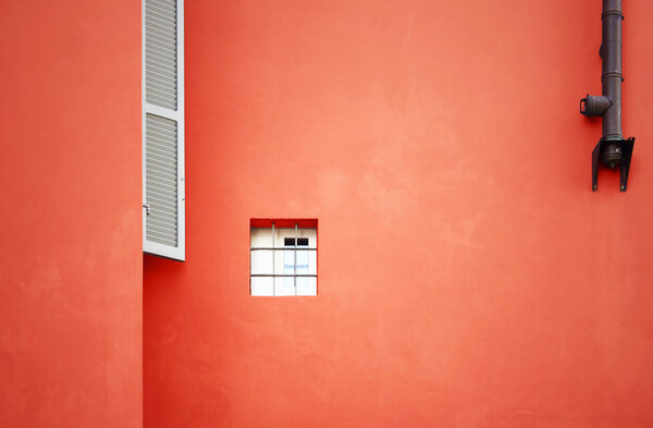 Characteristic facade in North Italy, with a very small closed window