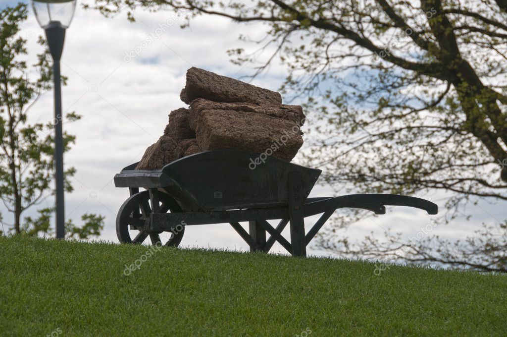 Wheelbarrow with peat