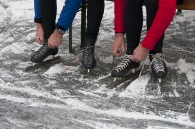 Man prepare skate for competition clipart