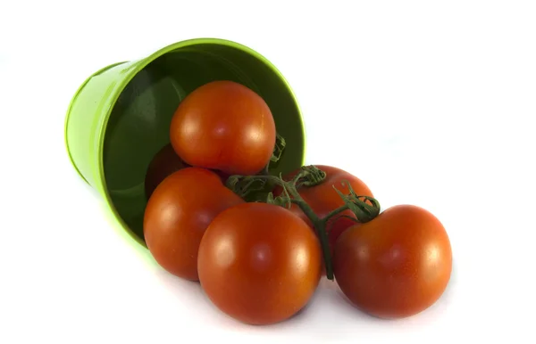 Green container with red tomatoes — Stock Photo, Image