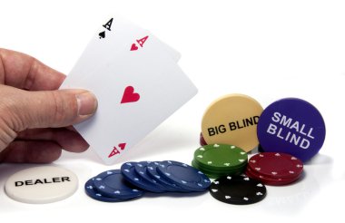 Hand with two aces during poker game clipart