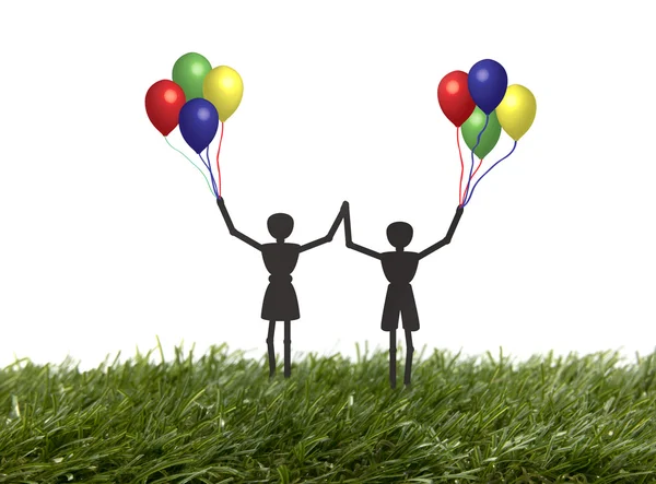 Kinder mit Luftballons im Gras — Stockfoto