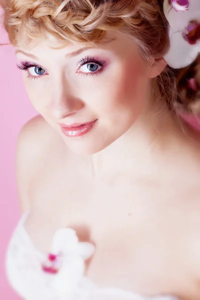 stock image Girl with orchid flower in hair