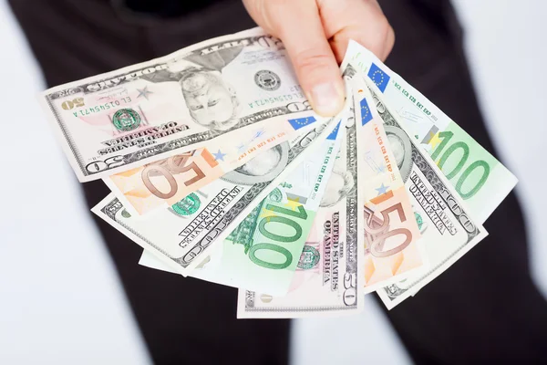 Man with dollar and euro — Stock Photo, Image