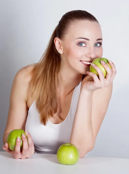 Mädchen mit Apfel Stockbild