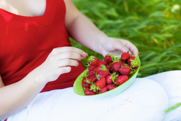 stock image Girl with straberry in garden