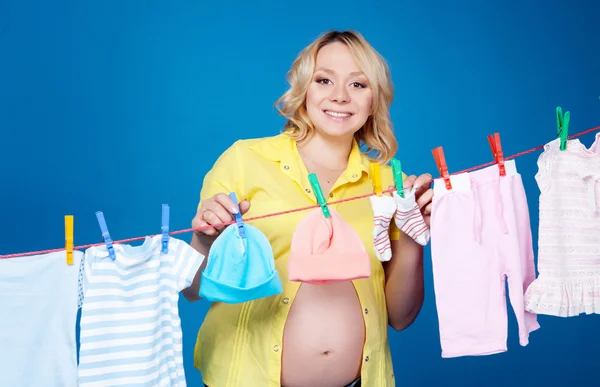 Woman with baby laundry — Stock Photo, Image