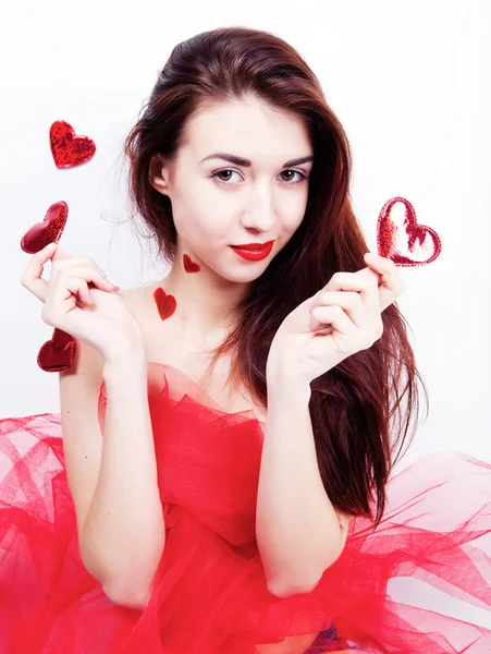 Brunette fille avec des cœurs rouges — Photo