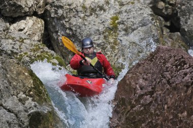 YALTA, UKRAINE - MARCH 27. Unknown kayak racer on the training of Russia kayakers on Belbek river on march 27, 2011 in Yalta, Ukraine clipart