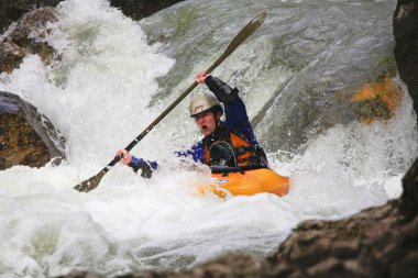 YALTA, UKRAINE - MARCH 7. Unknown kayak racer on the training of Russia kayakers on Belbek river on march 7, 2009 in Yalta, Ukraine clipart